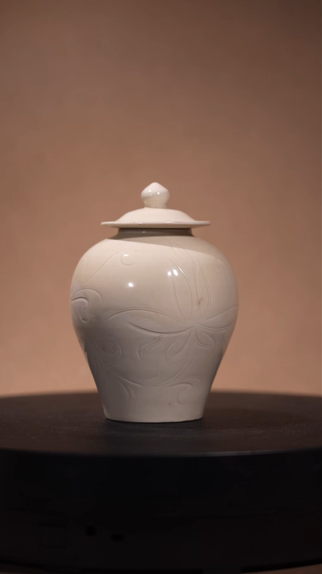 Ancient Chinese White-Glazed Lidded Jar with Carved Floral Motifs