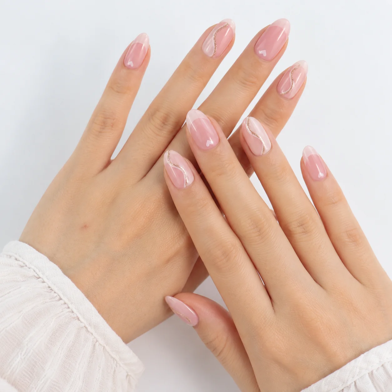 Pink Press On Nails Worn on Hands with Gold Wavy Line Design