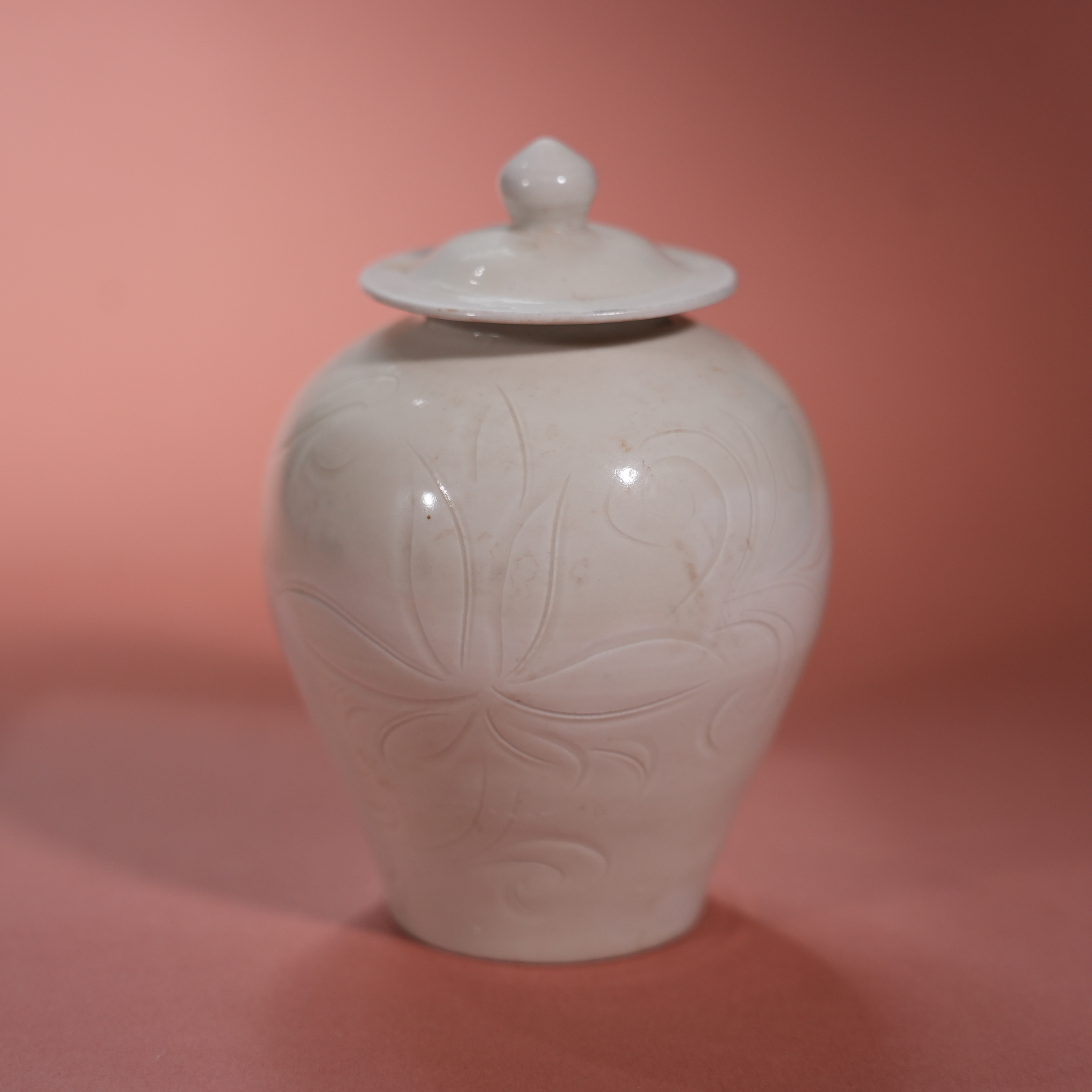 Ancient Chinese White-Glazed Lidded Jar with Carved Floral Motifs