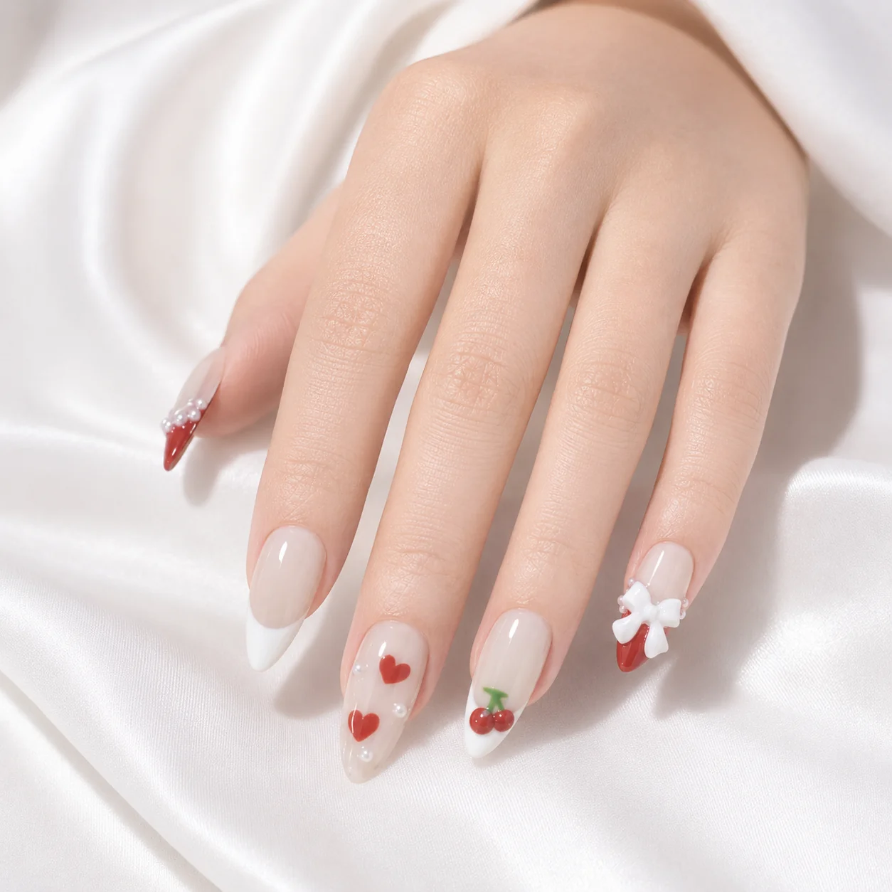 Cherry French Tip Press On Nails Worn on Hand with 3D Bow Detail