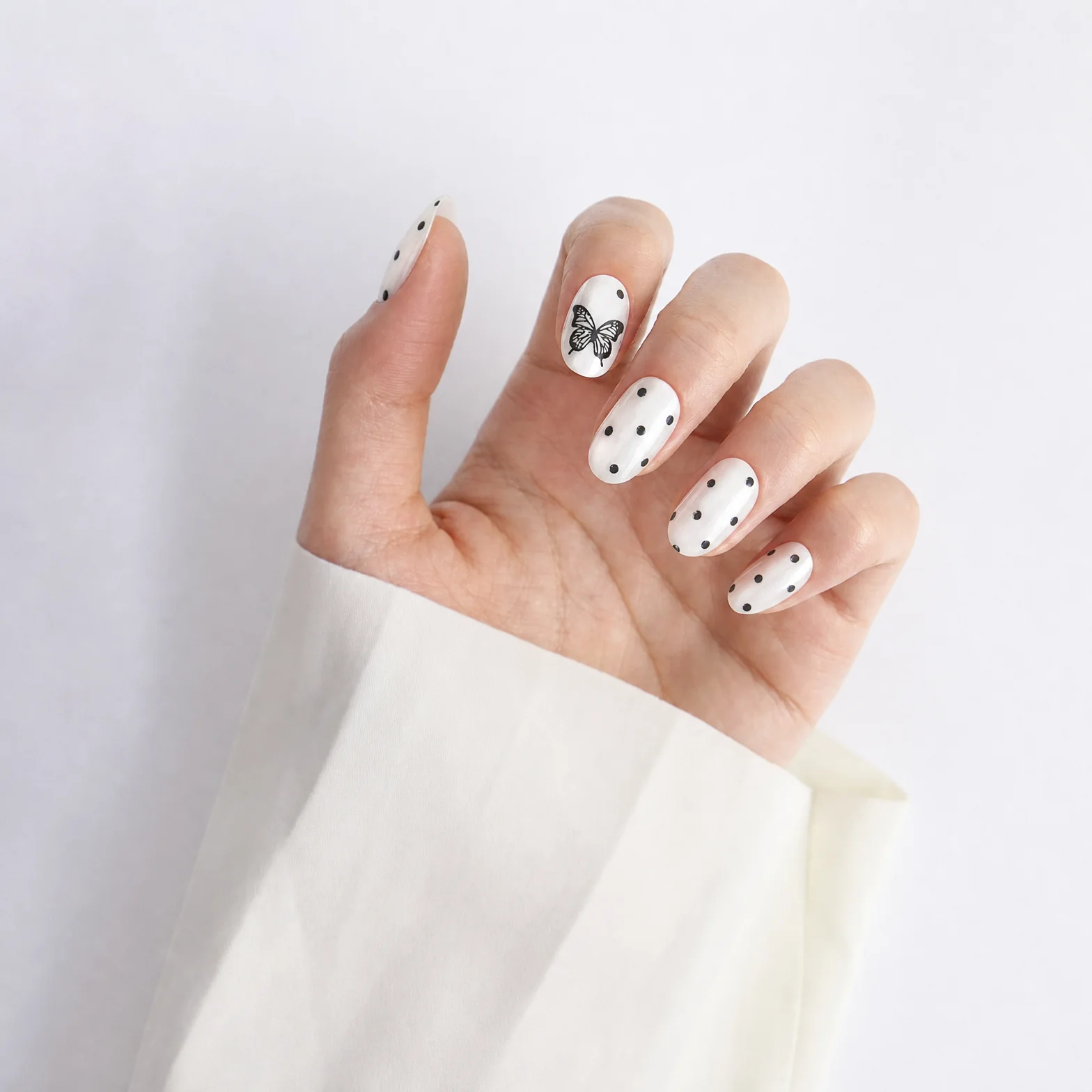 White Polka Dot Press On Nails Worn on Hand with Bow Design