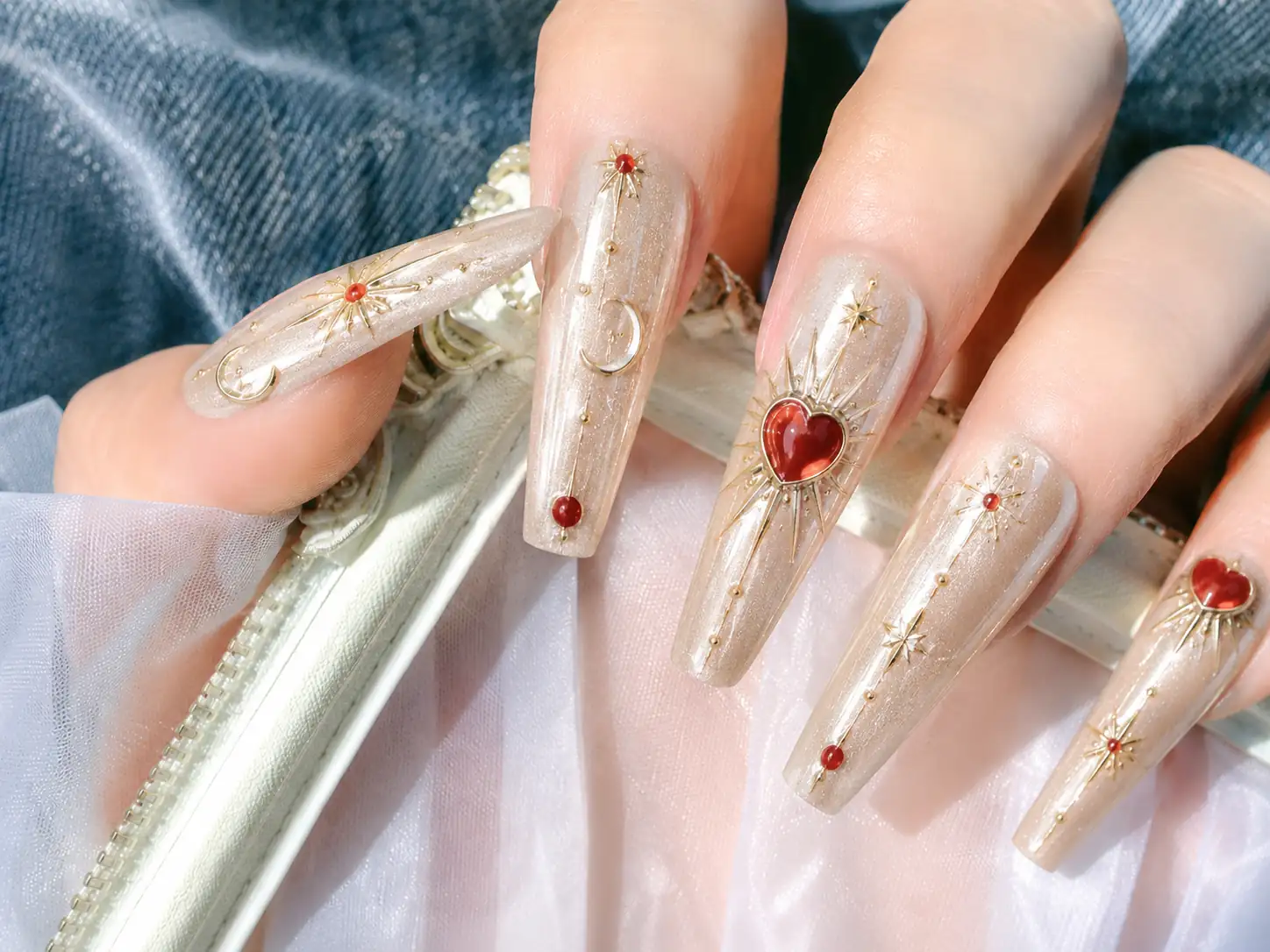 Luxury 3D nail art press on nails featuring gold metal details and red heart design, suitable for OEM and private label production.