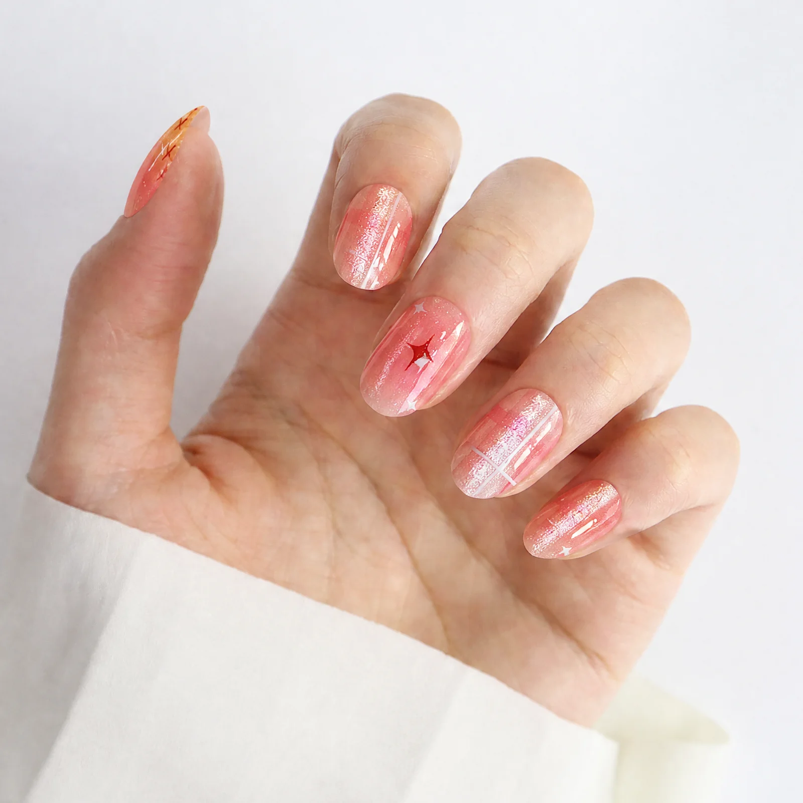 Coral Pink Press On Nails Worn on Hand with Glitter Details