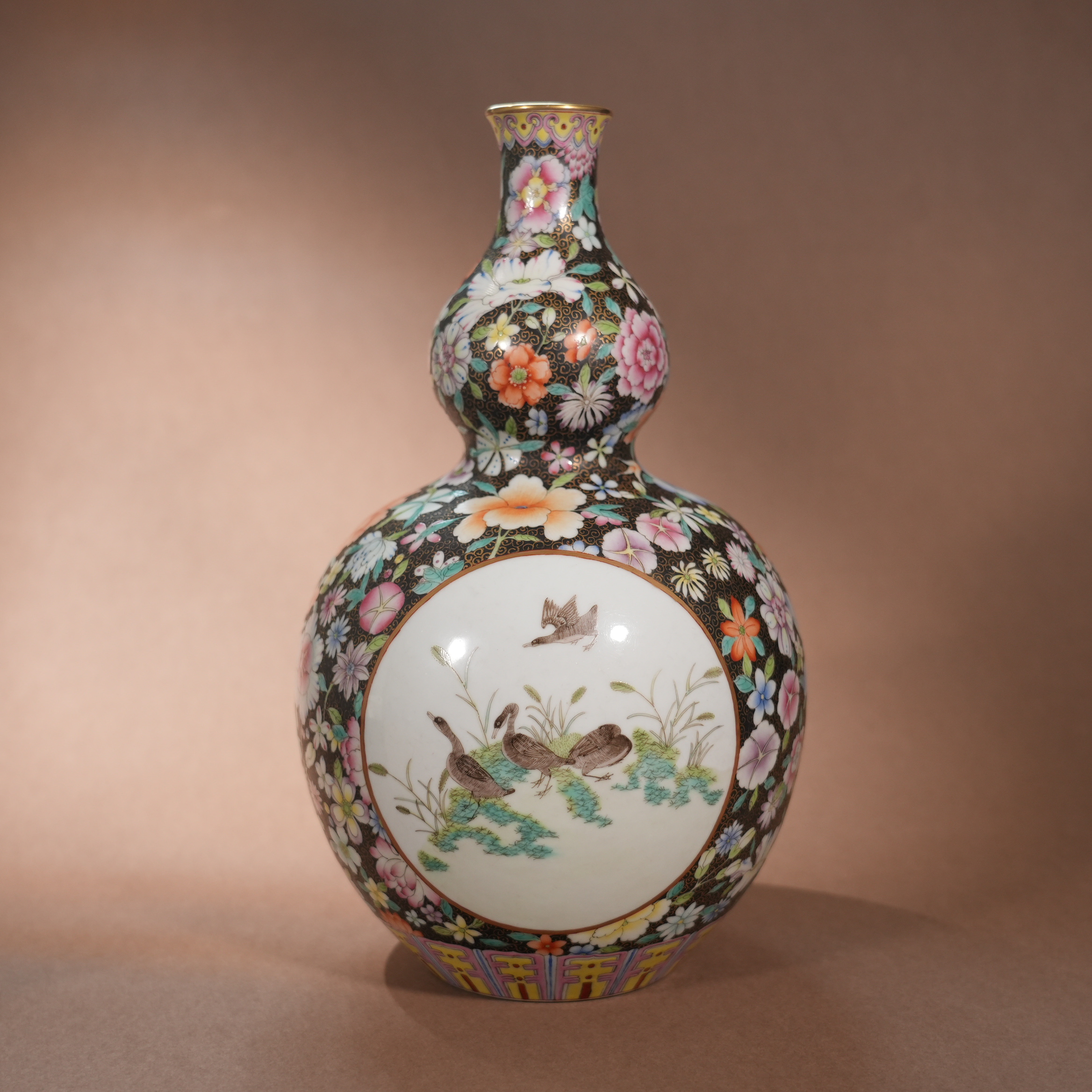 Ancient Chinese Black-Ground Famille Rose Gourd Vase with Hundred-Flower Pattern and Openwork Reed Wild Goose Motifs