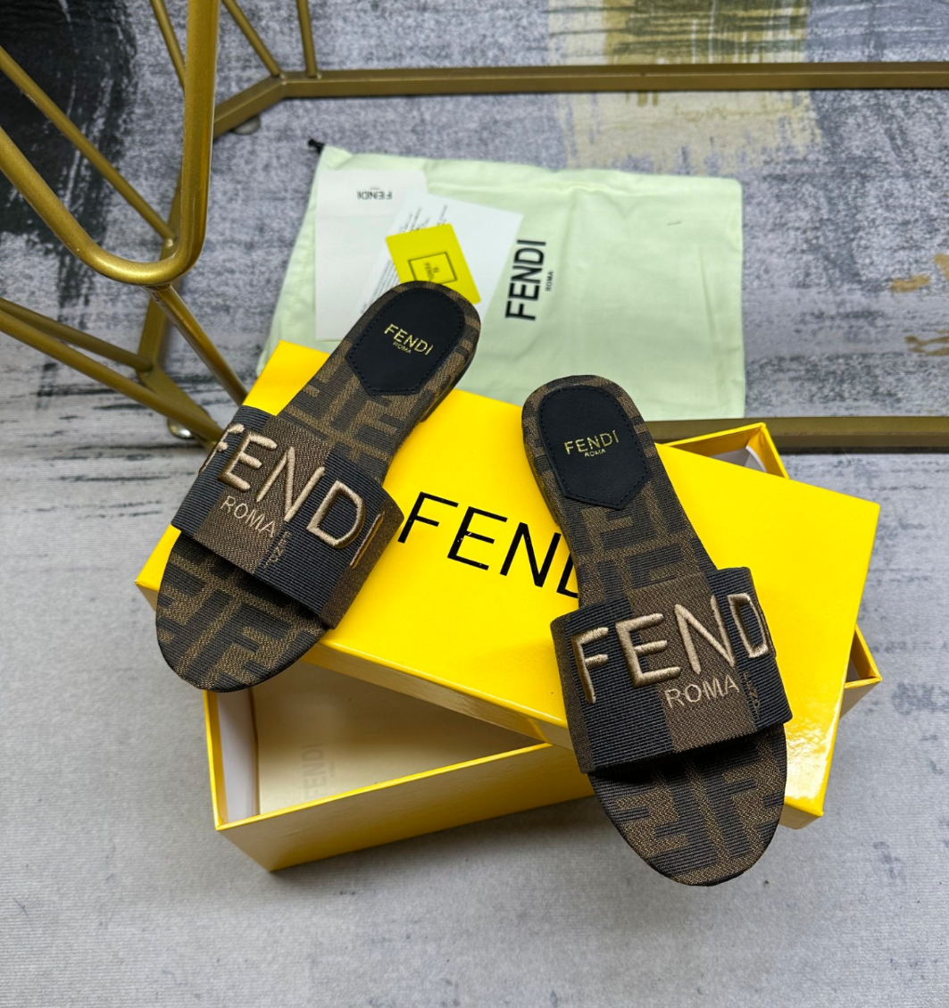 Fendi's latest jacquard striped canvas flat slippers