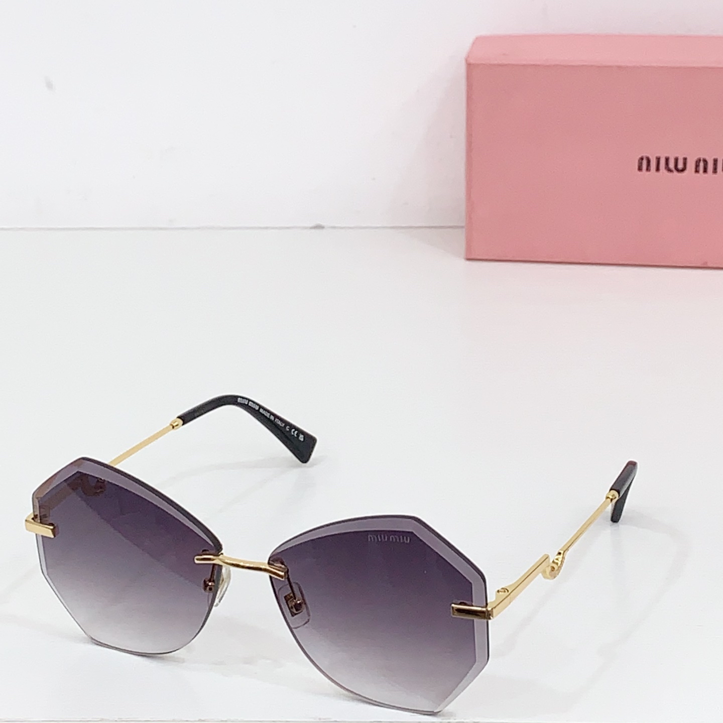 Miumiu frameless sunglasses