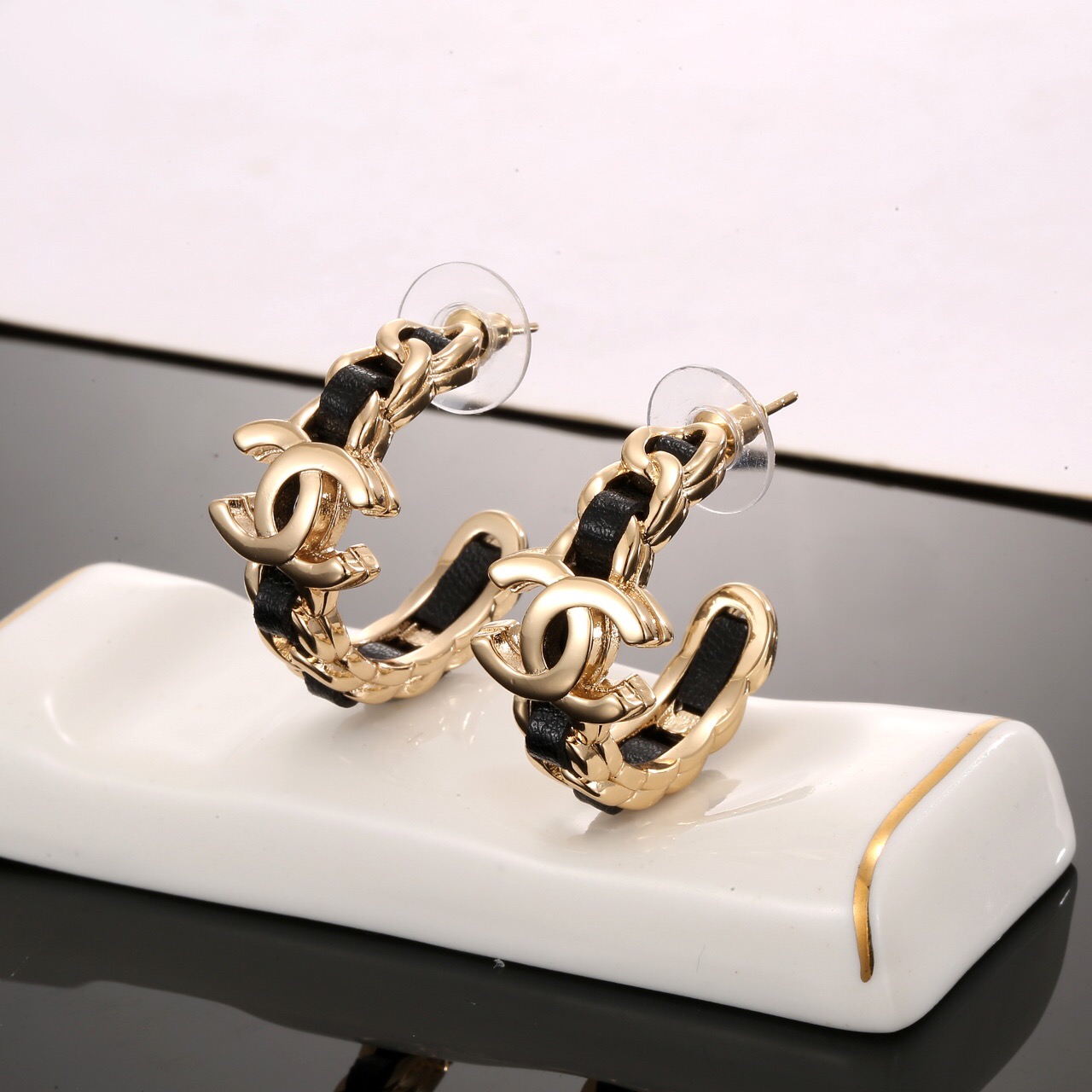 Chanel classic black leather stud earrings
