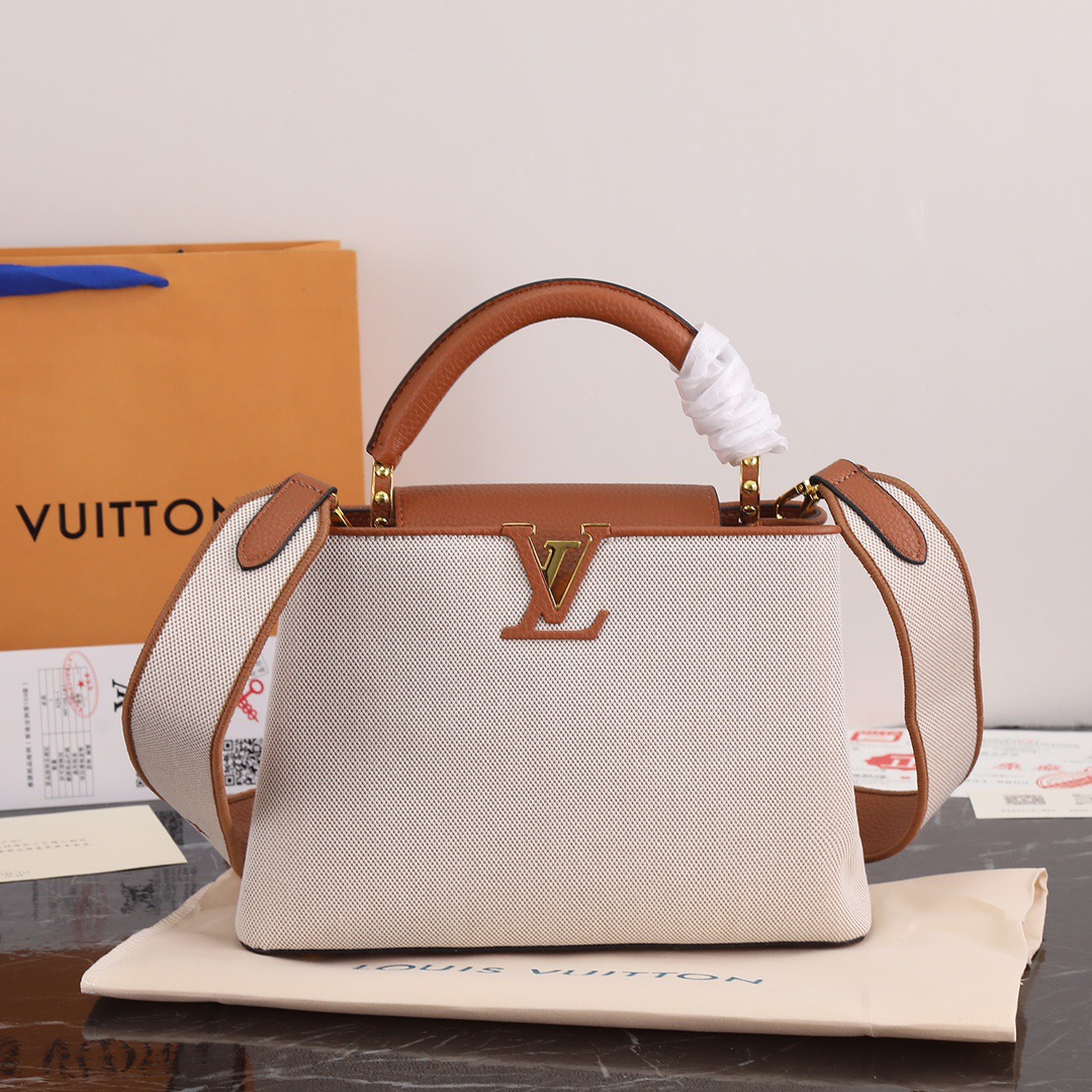 Louis Vuitton Calfskin handles and canvas tote bag