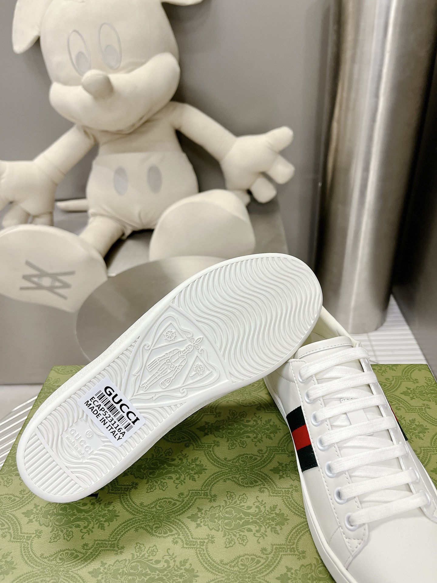 Gucci couple's high-top white shoes