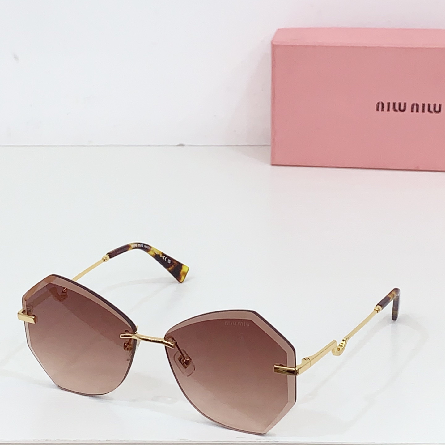 Miumiu frameless sunglasses