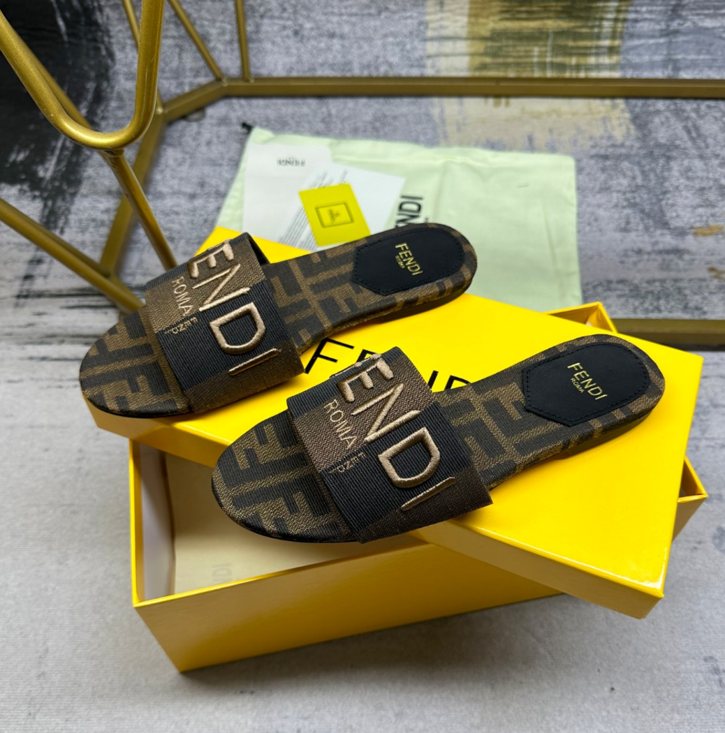 Fendi's latest jacquard striped canvas flat slippers