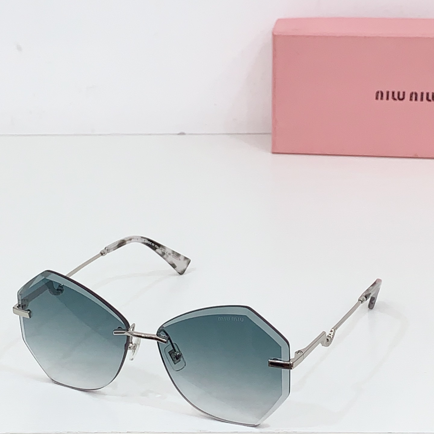 Miumiu frameless sunglasses