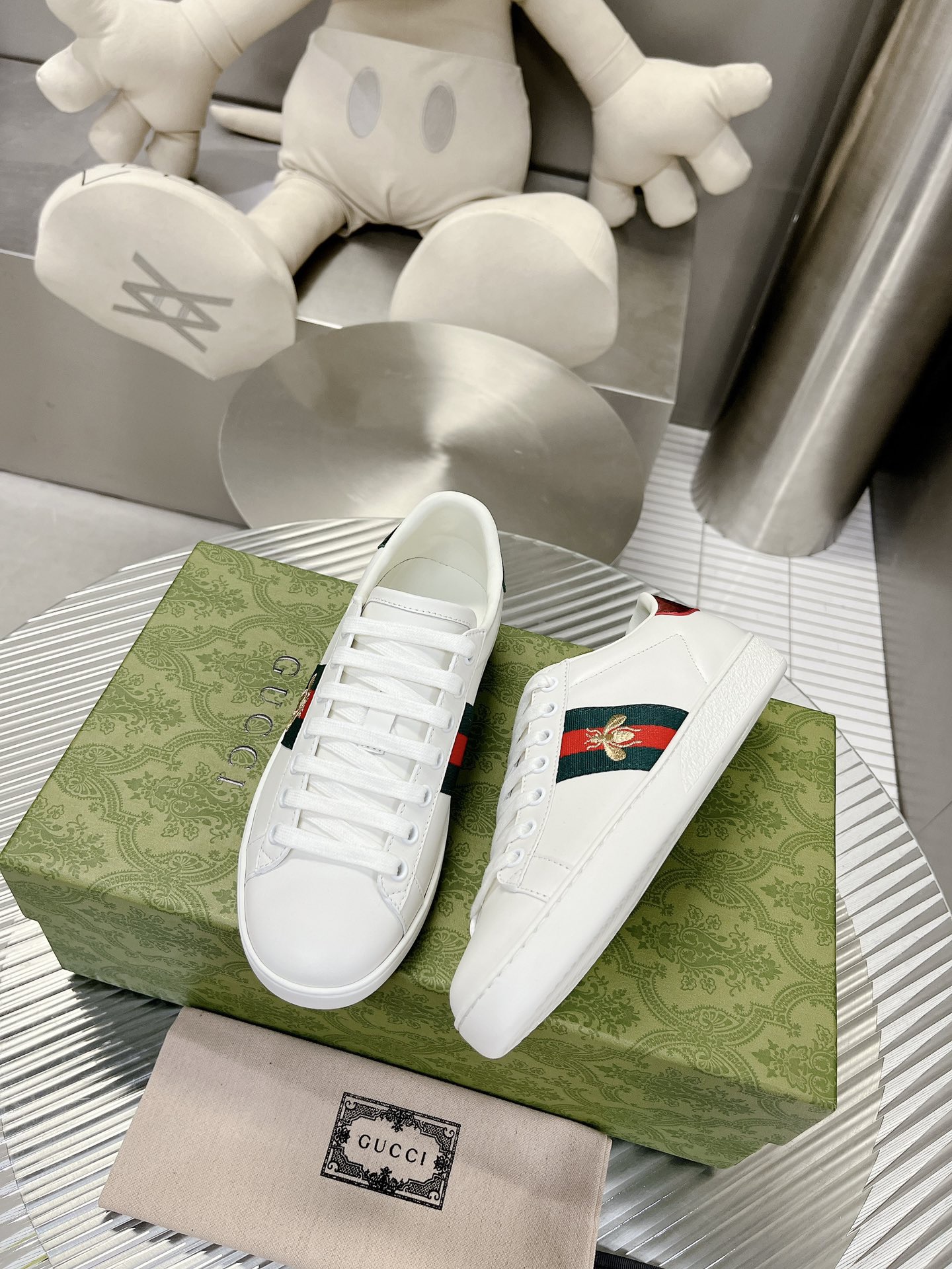 Gucci couple's high-top white shoes