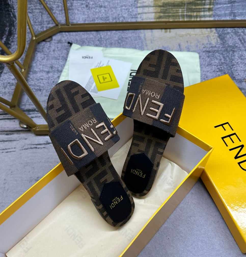 Fendi's latest jacquard striped canvas flat slippers