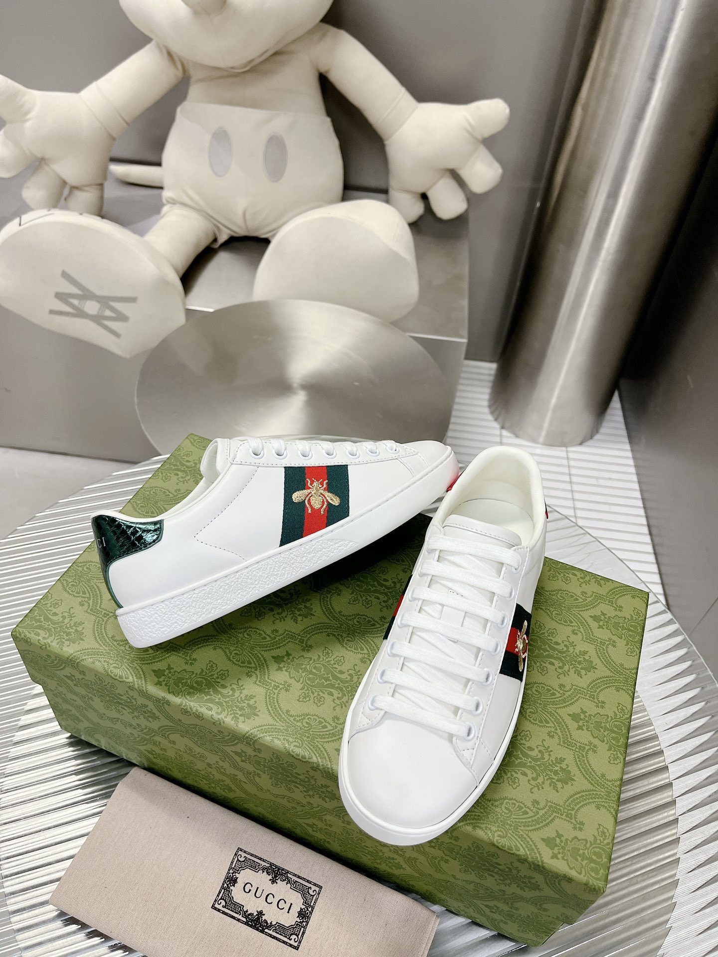 Gucci couple's high-top white shoes