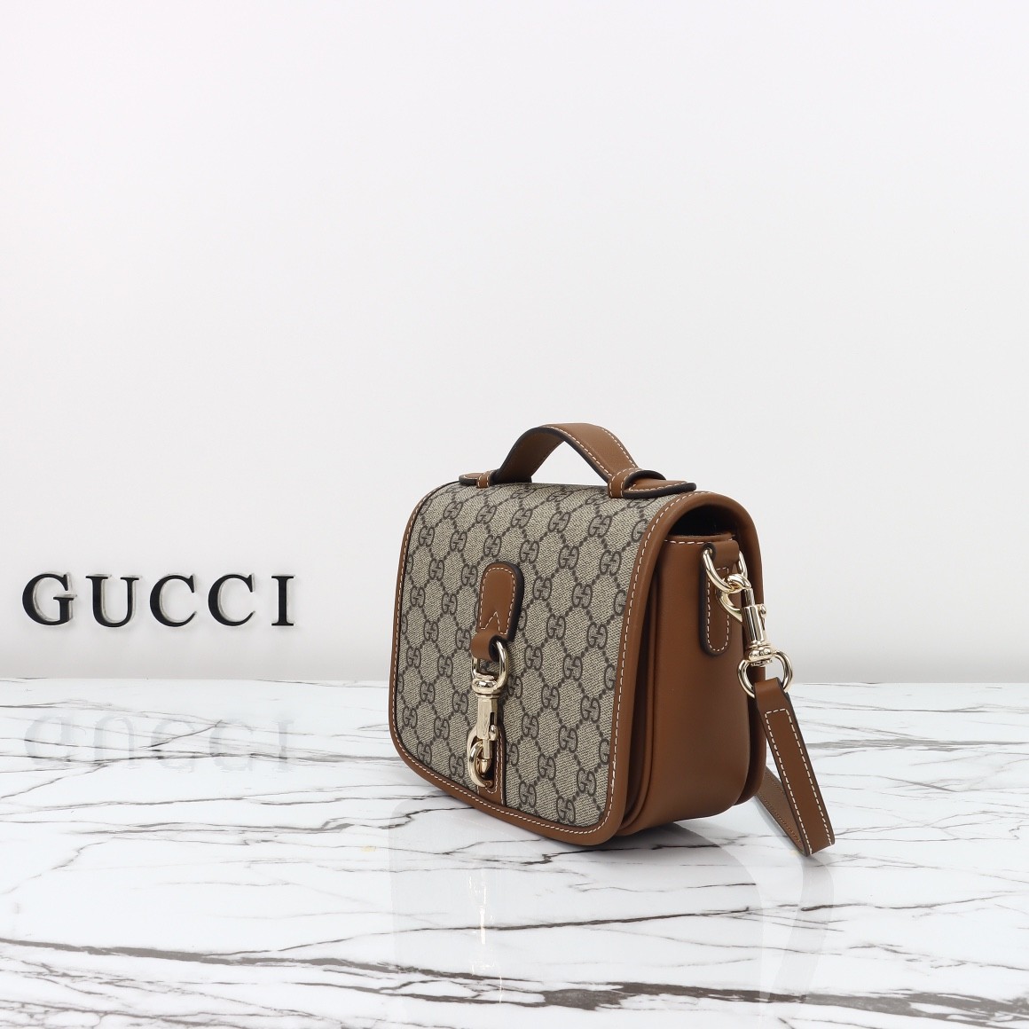 GUCCI Emblem GG mini shoulder bag
