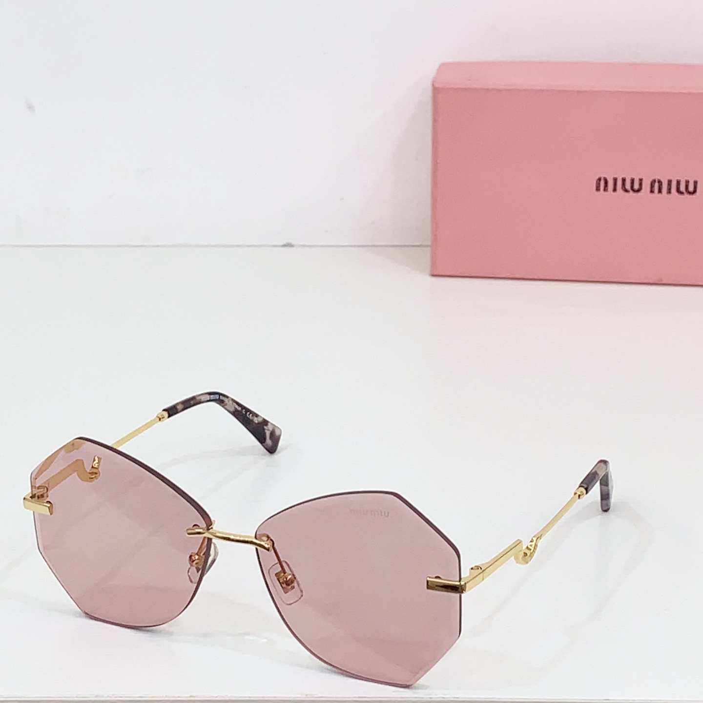 Miumiu frameless sunglasses