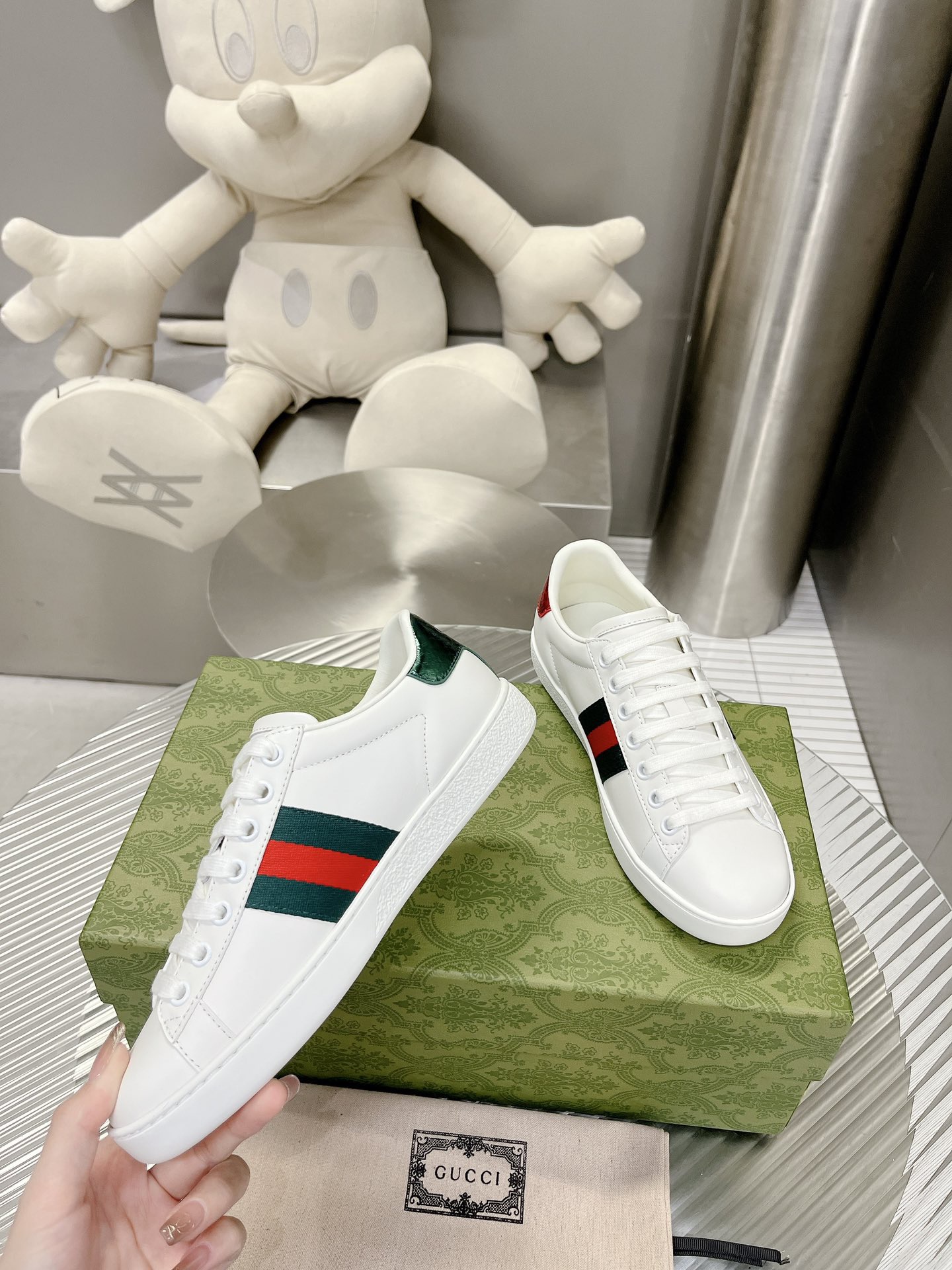 Gucci couple's high-top white shoes
