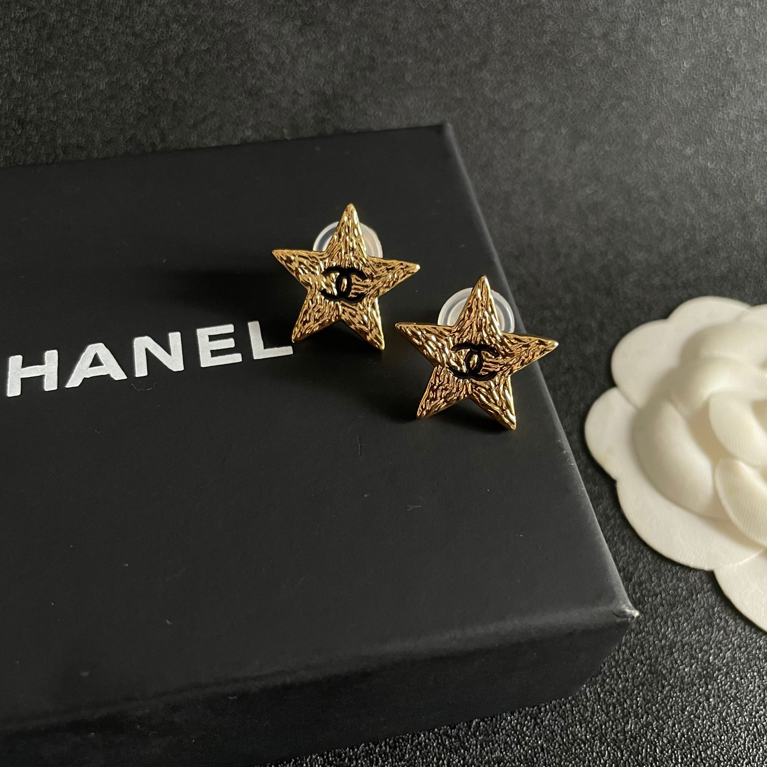 Chanel lava texture star earrings