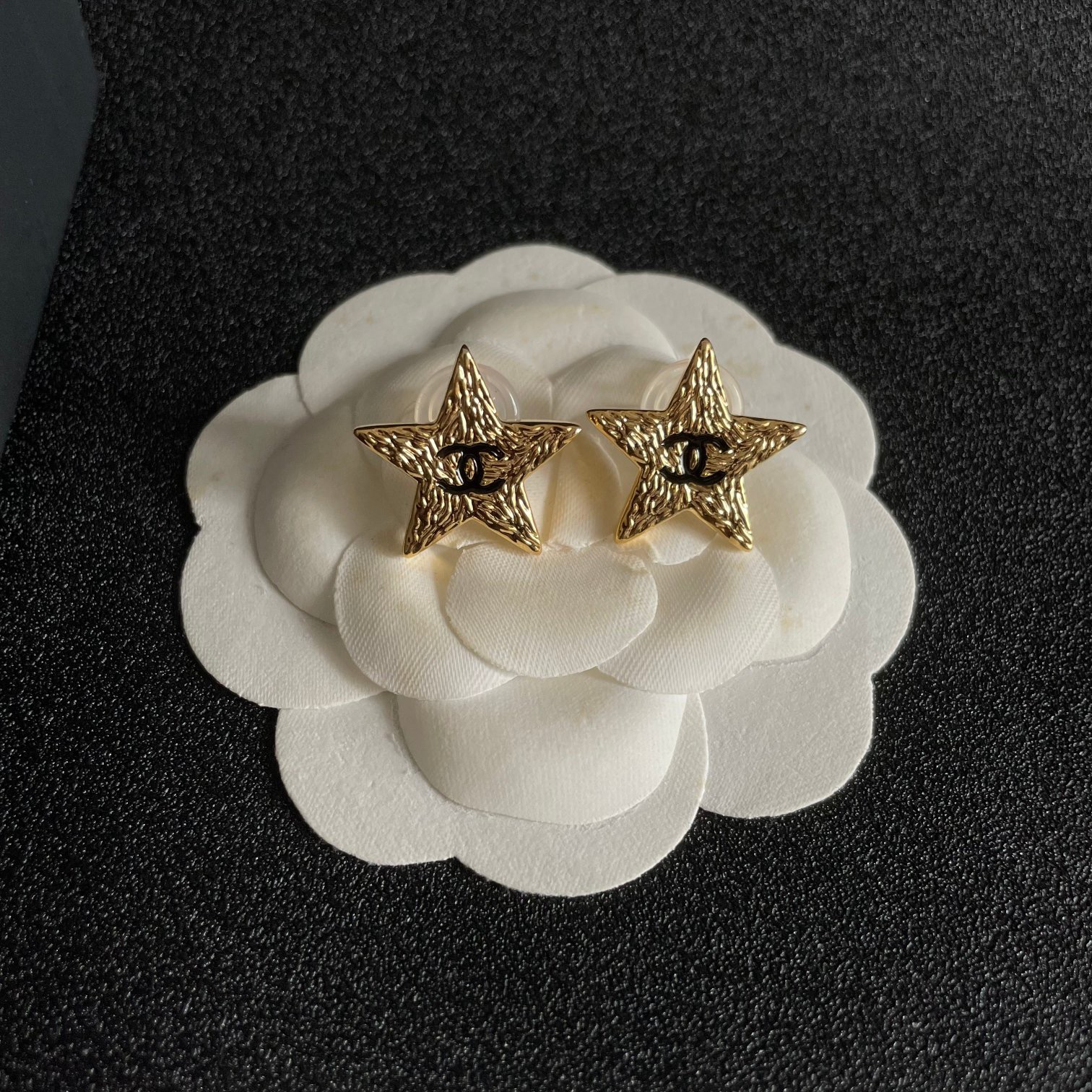 Chanel lava texture star earrings