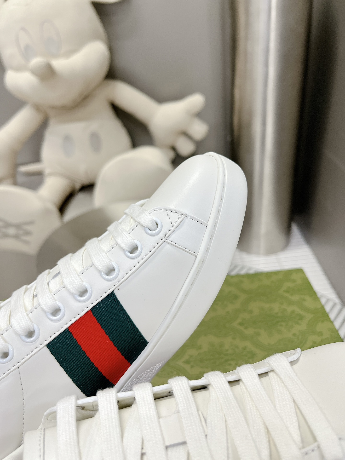 Gucci couple's high-top white shoes