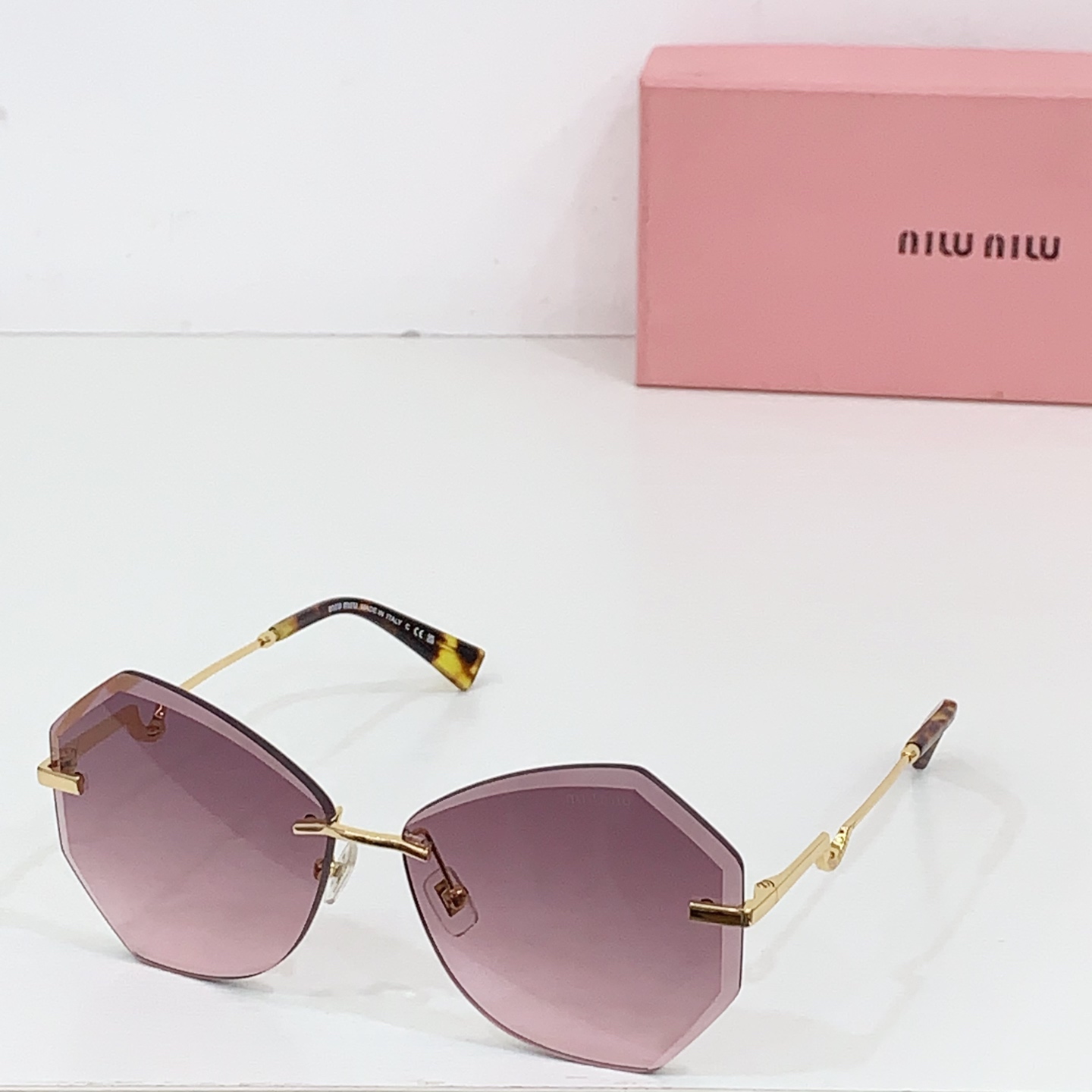 Miumiu frameless sunglasses