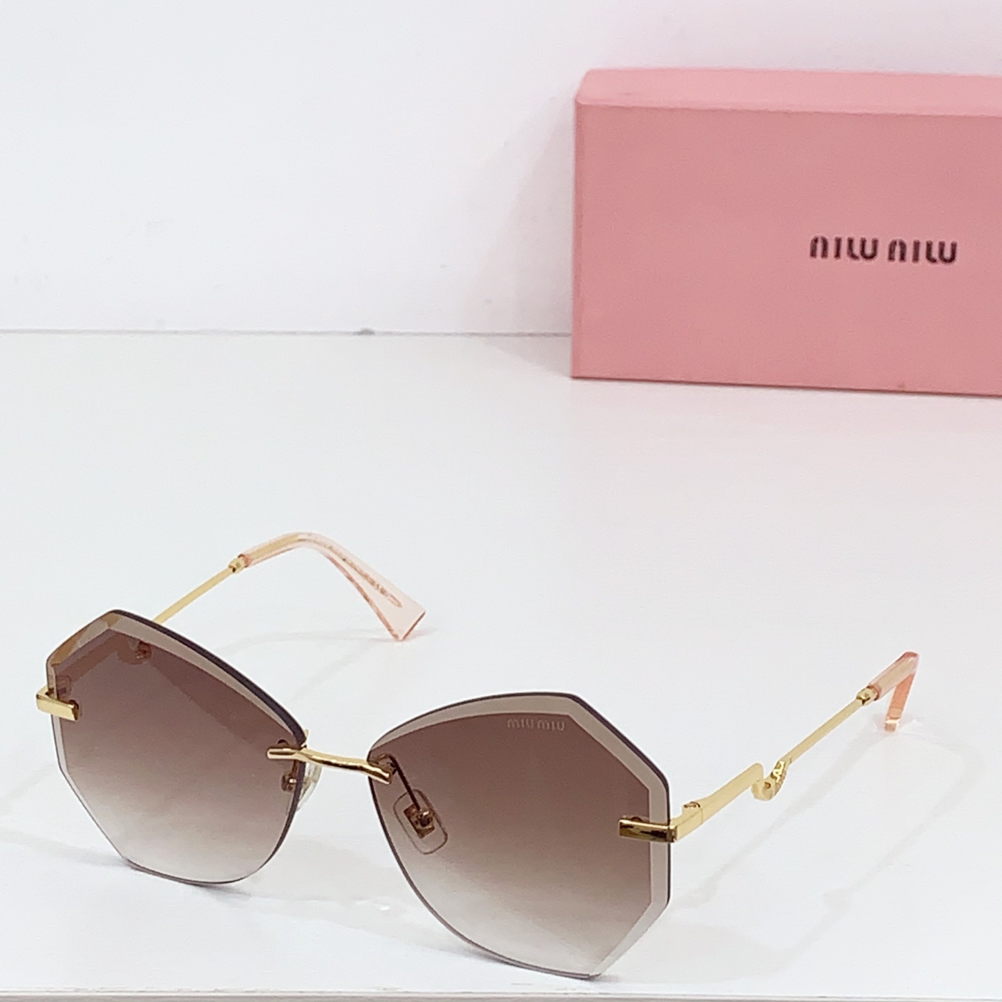 Miumiu frameless sunglasses