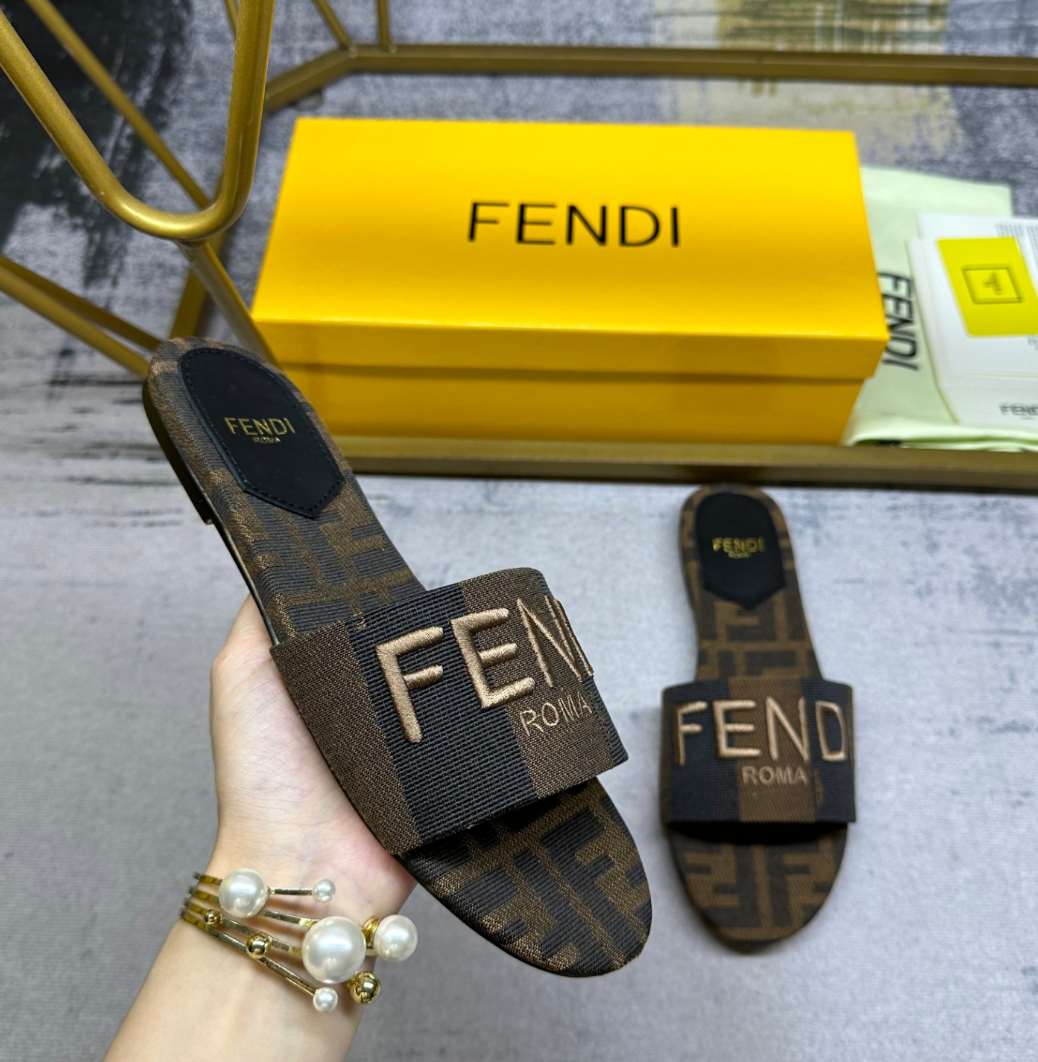 Fendi's latest jacquard striped canvas flat slippers