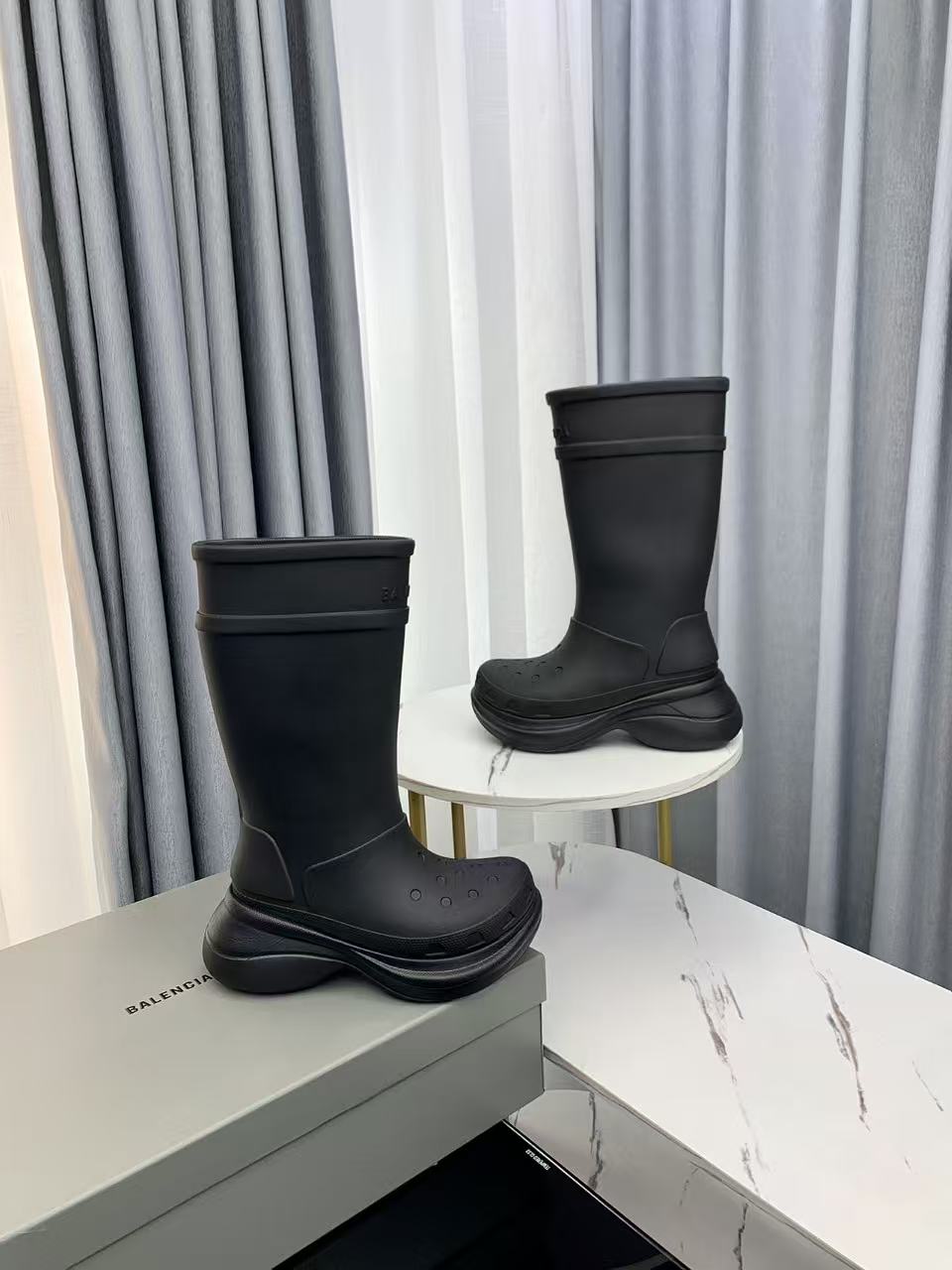 Balenciaga collaborates with Crocs on new hole-shaped rain boots