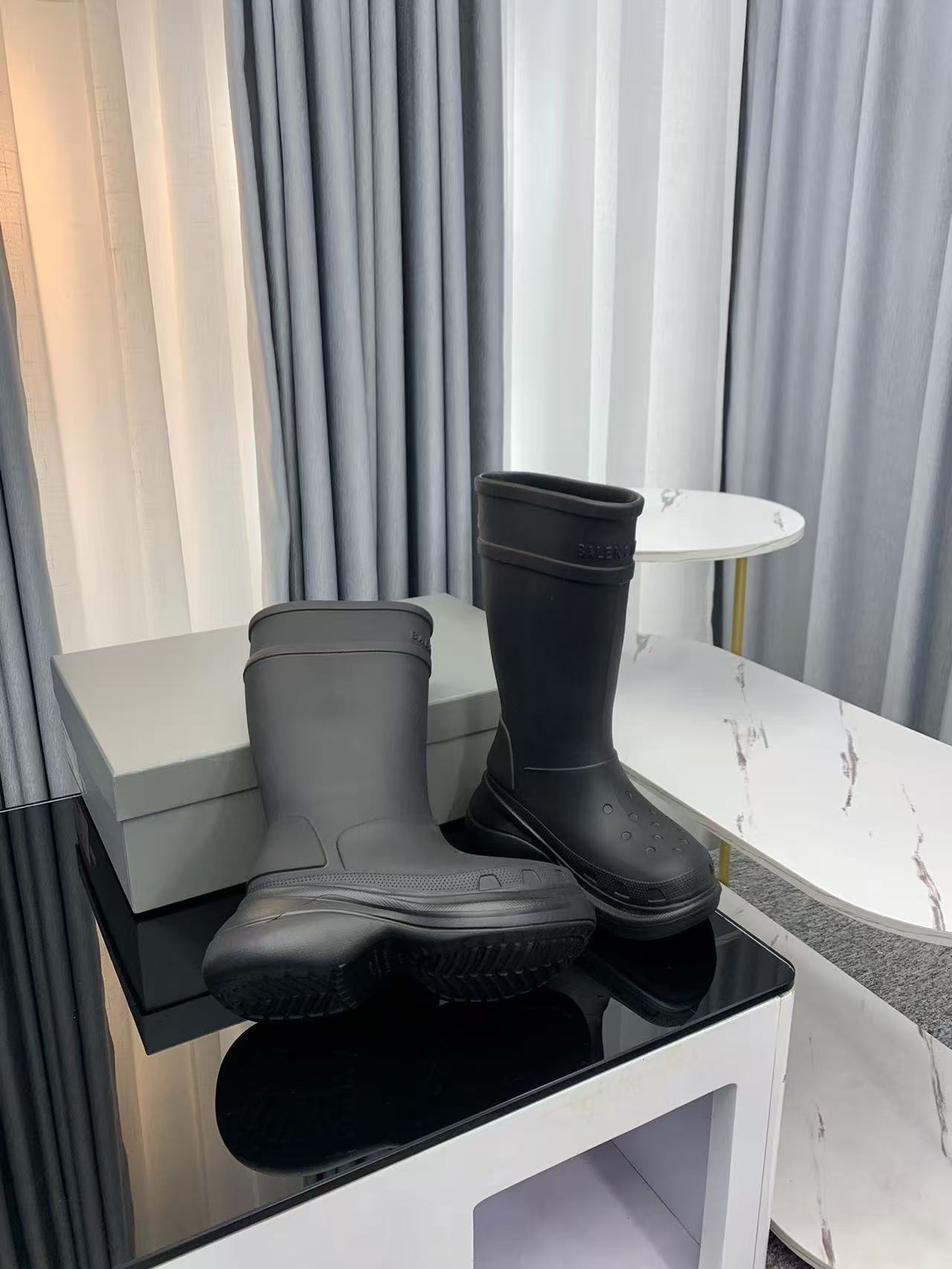 Balenciaga collaborates with Crocs on new hole-shaped rain boots