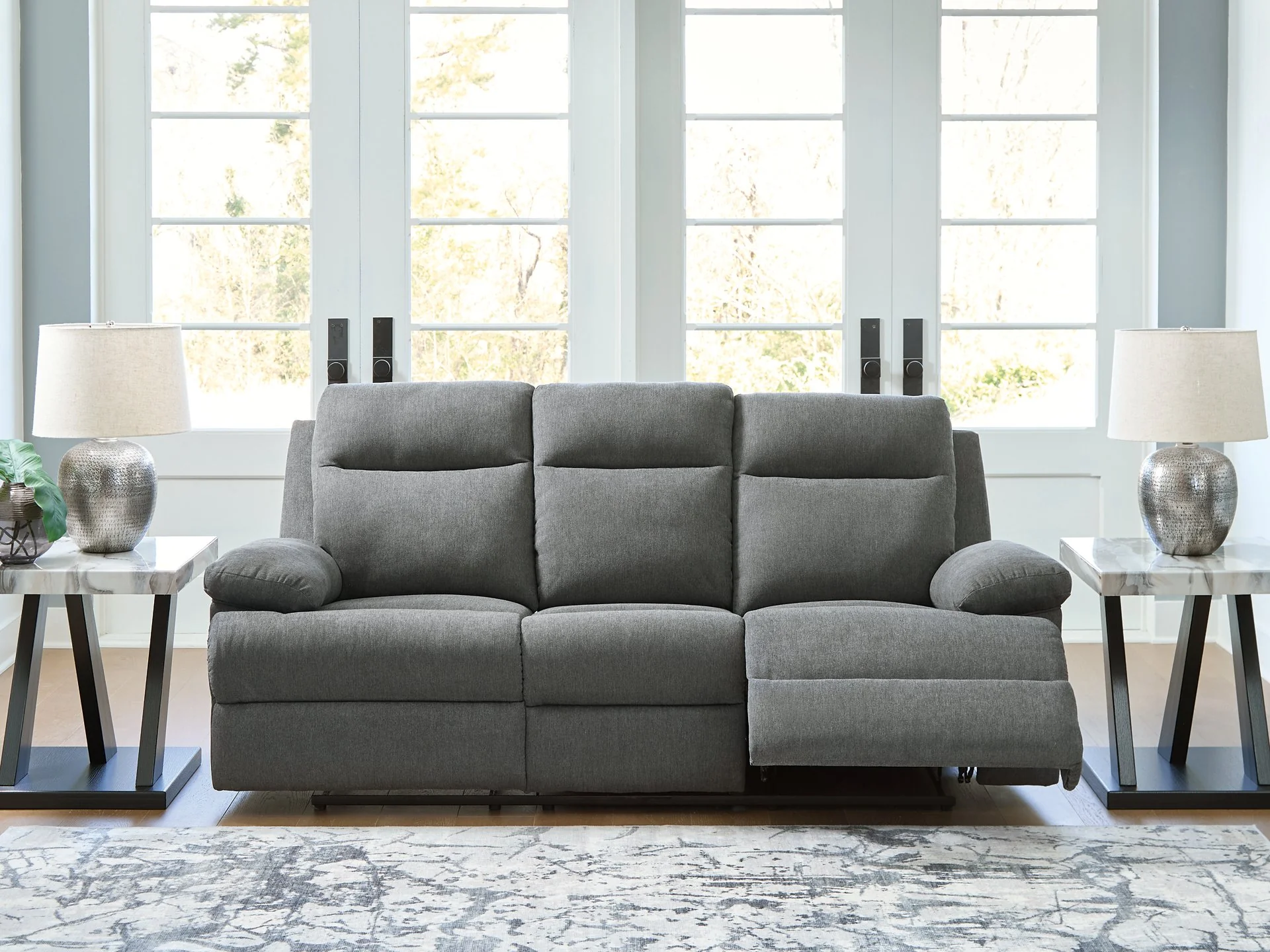 Side-Swipe Reclining Sofa with Drop Down Table