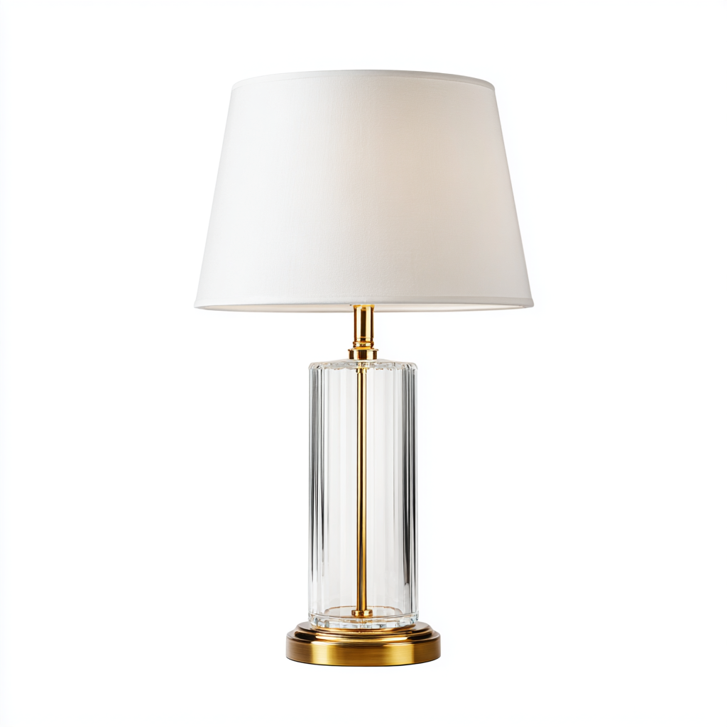 Lámpara de mesa de cristal transparente con detalles en dorado