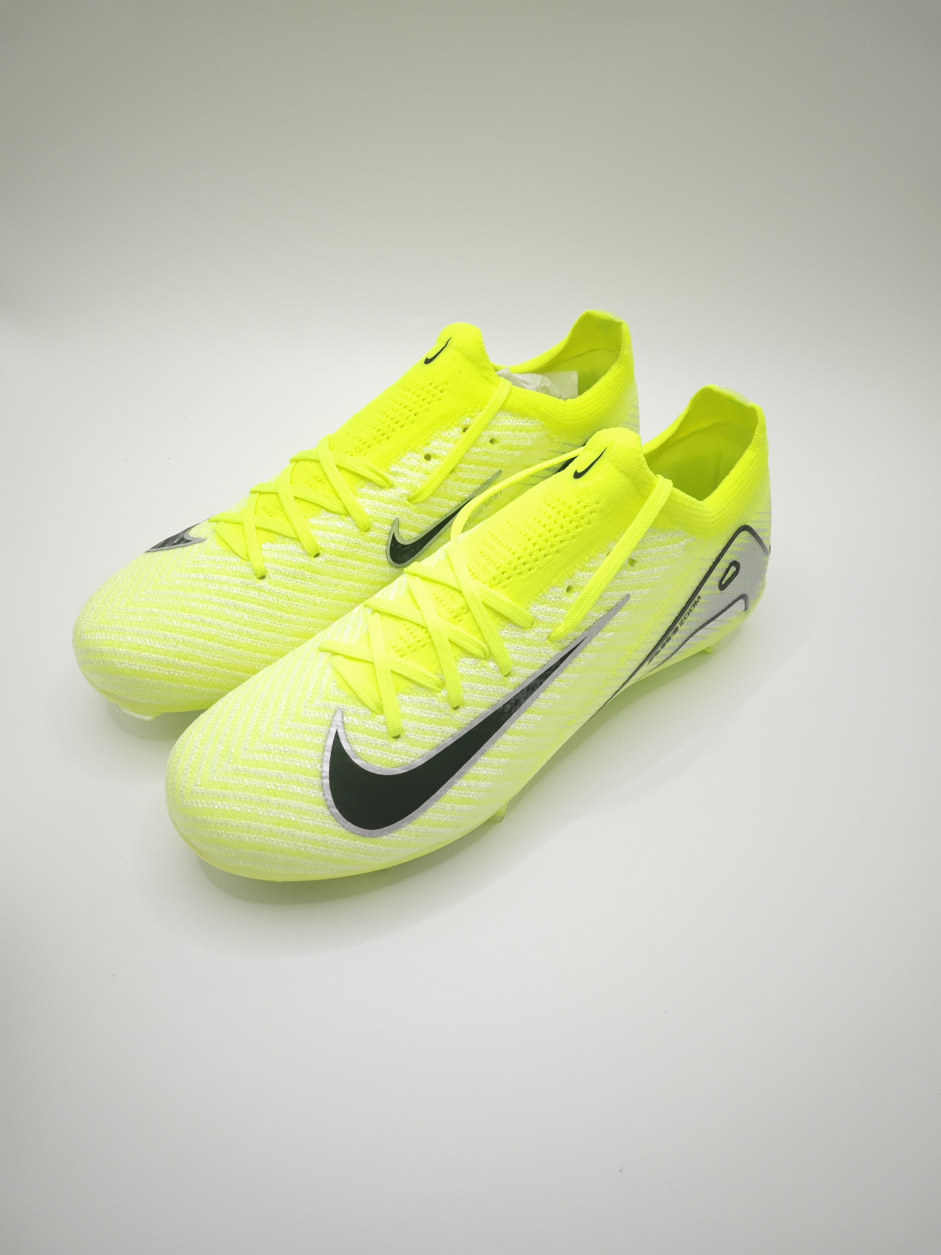 Nike Mercurial 16 FG Soccer Cleats with Built-in Bonded Pack: Full Air Cushion for All-Game Comfort, Waterproof Knit for Rainy Days